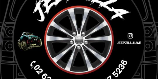 Jeepzilla logo on custom tire cover with contact info and social media handle.