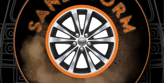 Sandstorm Circle Badge custom tire cover with wheel design and dust effects.