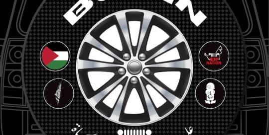 Burin Wheel Text Badge Custom Tire Cover with Jordan flag and Jeep Nation logos.