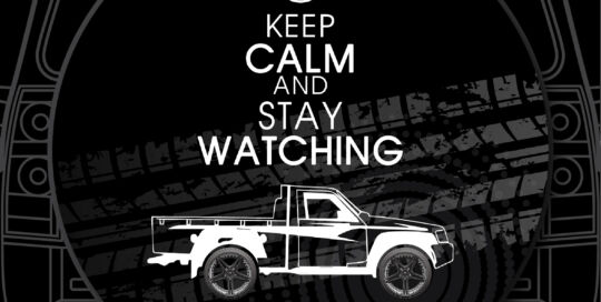 Custom truck tire cover with Nissan logo and 'Keep Calm and Stay Watching' message.