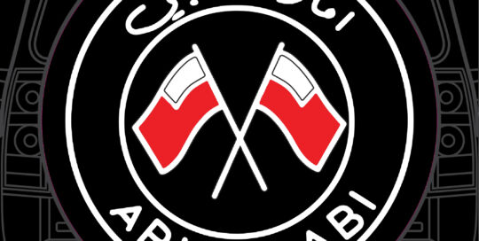 Abu Dhabi flags logo on custom tire cover with Arabic text.